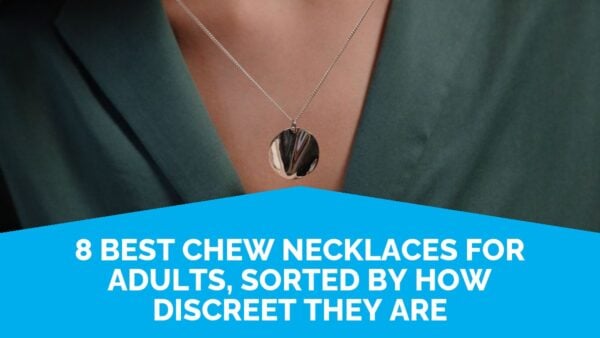 An Adult At Work Wearing A Discreet Chew Necklace For Adults, A Plain Silver Pendant, With A Blazer.